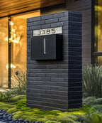 Modern Brick wall with contemporary  black mailbox.